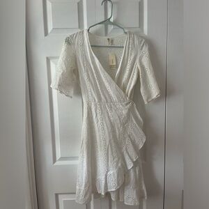 White eyelet wrap dress. Never worn with tags